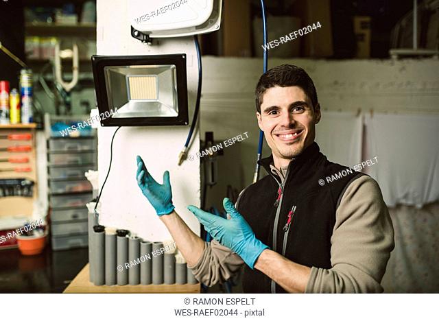 Portrait of a smiling mechanic in his workshop
