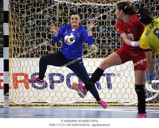 Czech Republic goalkeeper Petra Kudlackova neutralising a throw by Romania's Cristina-Georgiana Neagu (R) during the 2017 World Women's Handball Championship...