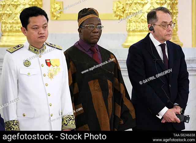 RUSSIA, MOSCOW - APRIL 5, 2023: Ambassadors PichKhun Panha of Cambodia, Ambrose Mutinhiri of Zimbabwe, and Roland Galharague (L-R) of the EU attend a ceremony...