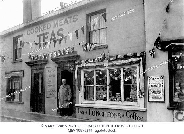 A cafe on the High Street, Walton-on-the-Naze, Essex, decorated to celebrate the Coronation of King George VI. There are advertisements for Cooked Meats