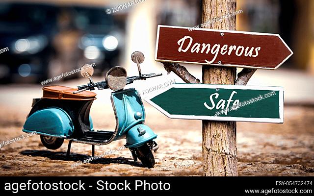 Street Sign the Direction Way to Safe versus Dangerous