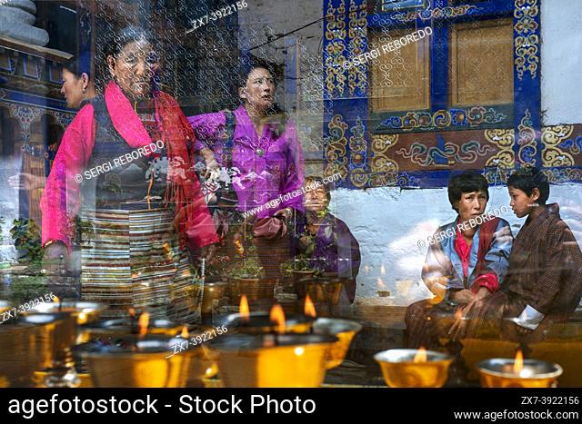 Incense and candles in at small Kyichu Lhakhang Temple near Paro in Himalayas mountains Bhutan, South Asia, Asia. Inner courtyard with an incense burner and...
