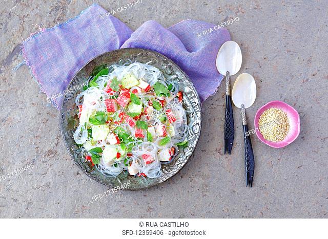 Soya bean pasta nad surimi salad with herbs