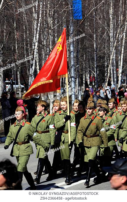 Students cadets dressed in the form of various types of troops of the Red Army at the celebration of the Victory in the city of Nizhnevartovsk