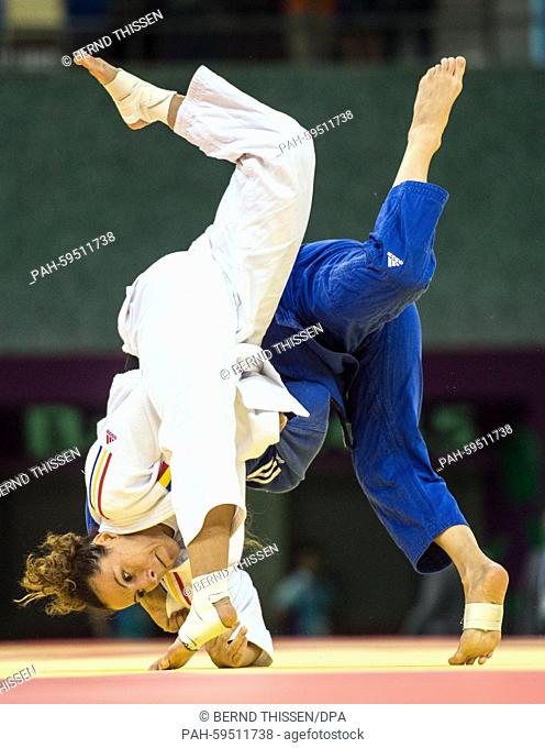 Germanys Mareen Kraeh (blue) competes with Andreea Chitu of Rumania in the Women's -52kg Judo Women's Semifinal of Table B at the Baku 2015 European Games in...