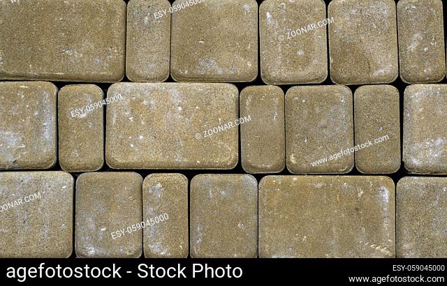 Concrete or cobble gray pavement slabs or stones for floor, wall or path. Traditional fence, court, backyard or road paving