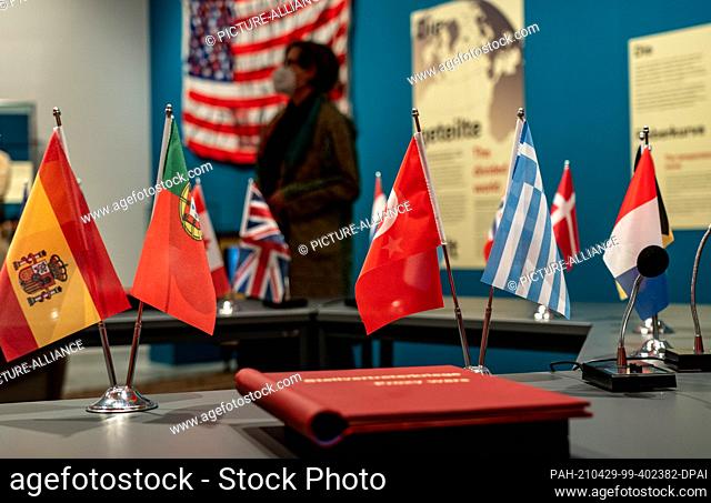 29 April 2021, Schleswig-Holstein, Molfsee: A woman looks at the exhibits in the special exhibition on the Cold War in the Jahrhunderthaus at the Molfsee...