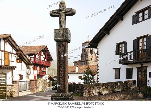 Ancient stone cross on a street in the village of Etxalar. Etxalar, Cinco Villas, Bortziriak, Navarre, Spain, Europe
