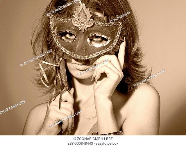 portrait of woman with masquerade mask