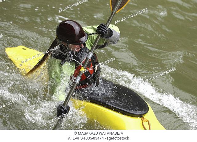 Kayaker Negotiating the River
