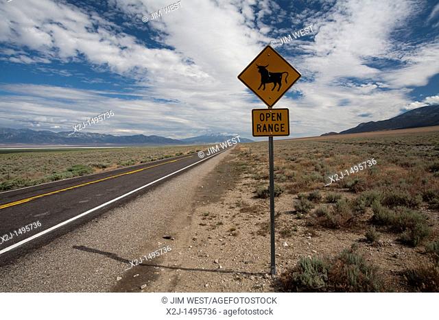 Ely, Nevada - A sign along state highway 893 warns that cattle may be on the road  Wheeler Peak in Great Basin National Park is in the distance