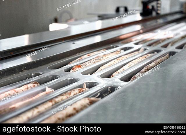 Sausages. Packing line of sausages. Industrial manufacture of sausage products. High quality photo