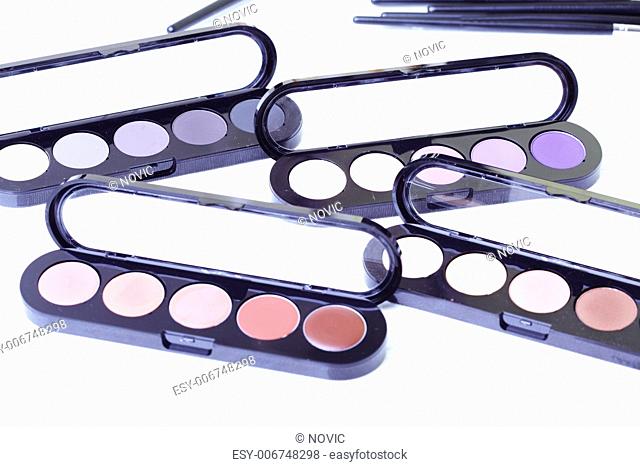 Close-up photo of the makeup set on textured white background