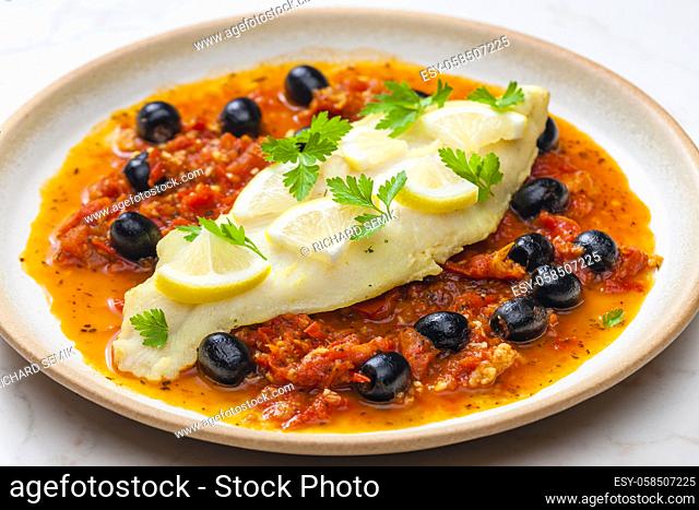cod on tomato sauce with black olives