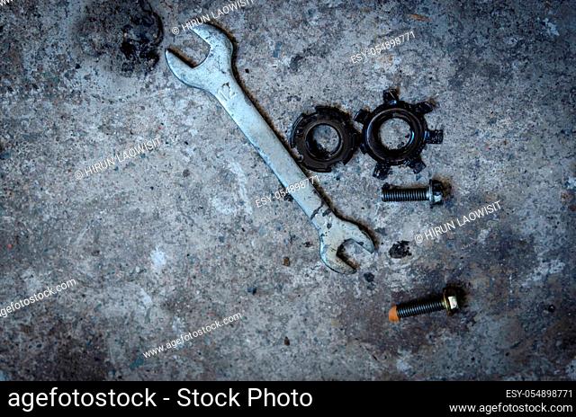 Motorcycle repair tools on the ground