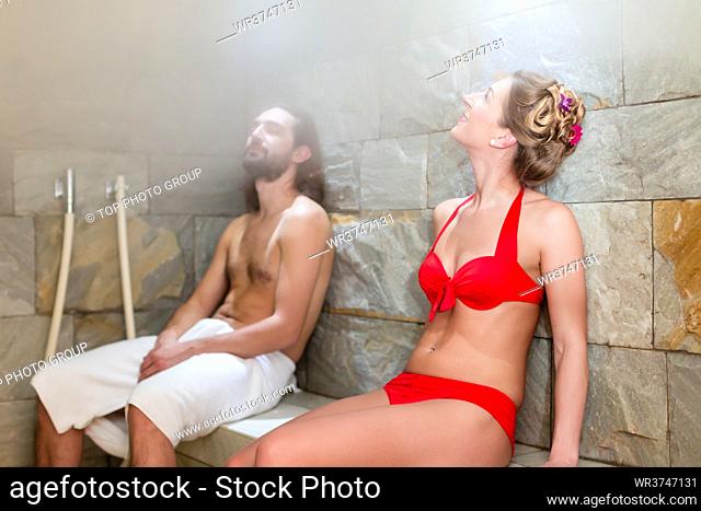 Couple in wellness spa steam bath