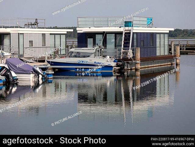 17 August 2022, Mecklenburg-Western Pomerania, Ribnitz-Damgarten: A police boat lies in the harbor of Ribnitz-Damgarten. On the evening of August 16