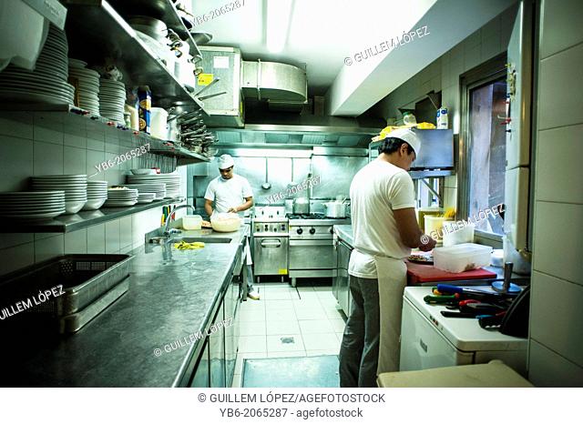 People working in a small professional kitchen, Trattoria da Bepi, Venice, Italy., Venice, Italy