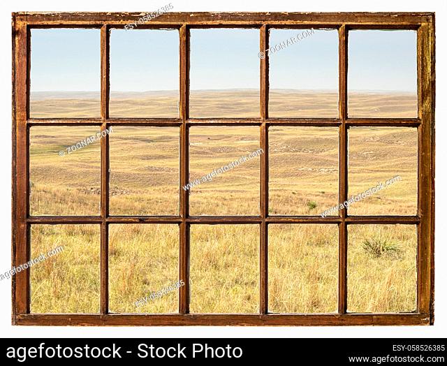 midday scenery of Nebraska, early fall scenery with haze from Colorado wildfires as seen from a vintage sash window
