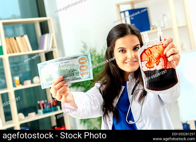 Female doctor in blood transfusion concept