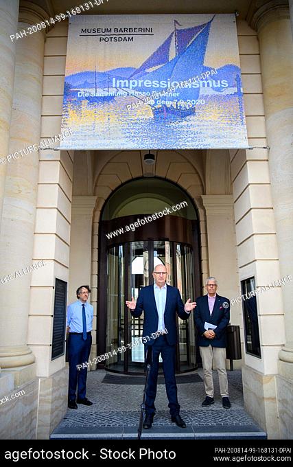 14 August 2020, Brandenburg, Potsdam: Dietmar Woidke (M, SPD), Minister President of Brandenburg, begins his press tour by speaking in front of the entrance to...