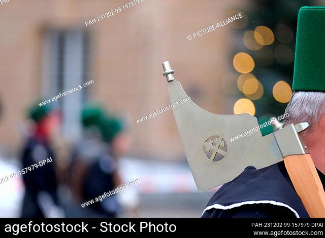 02 December 2023, Saxony, Chemnitz: Participants in a mining parade parade across Theaterplatz. On the eve of the first Advent