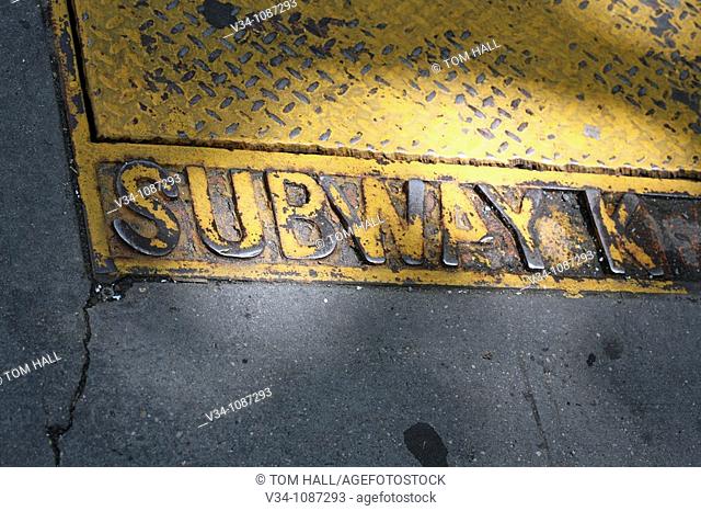 A cast iron lid/sign of the New York subway