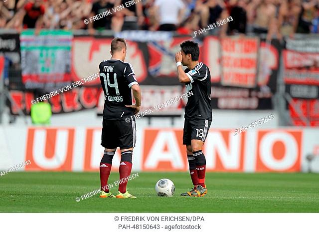 Nuremberg's Robert Mak (L) and Hiroshi Kiyotake stand on the pitch during the German soccer Bundesliga match between 1. FSV Mainz 05 and 1