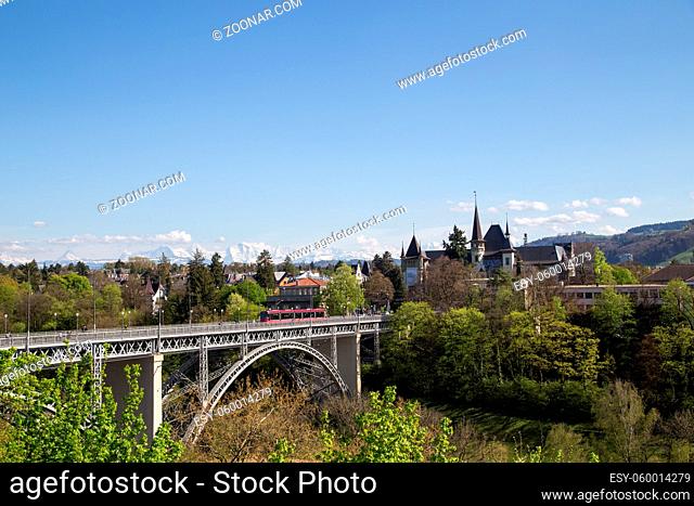 Bern, Switzerland - April 13, 2017: Train driving over Kirchenfeld Bridge in the historic city centre
