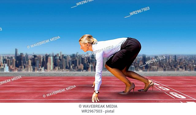 Digital composite image of businesswoman on starting line of race tracks in city against sky