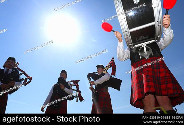 19 August 2023, Baden-Württemberg, Horgenzell: Bagpipe music is played at the beginning of the 11th Upper Swabian Highland Games on the competition field