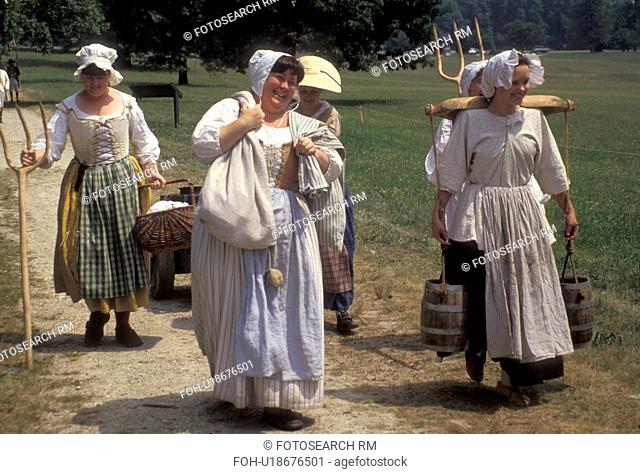 Valley Forge Park, reenactment, Valley Forge, Pennsylvania, Women dressed in traditional colonial costumes walk together at the reenactment of the American...