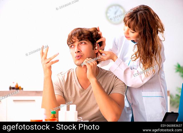 Patient with hearing problem visiting doctor otorhinolaryngologist