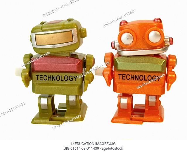 Two wind-up toy robots
