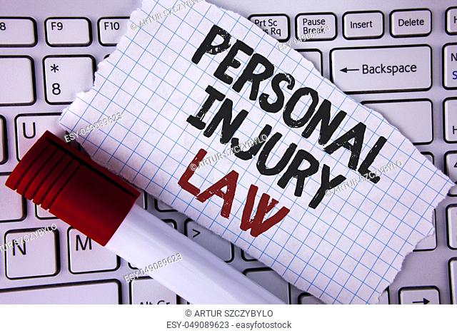 Conceptual hand writing showing Personal Injury Law. Business photo text guarantee your rights in case of hazards or risks written Tear Notebook paper placed...