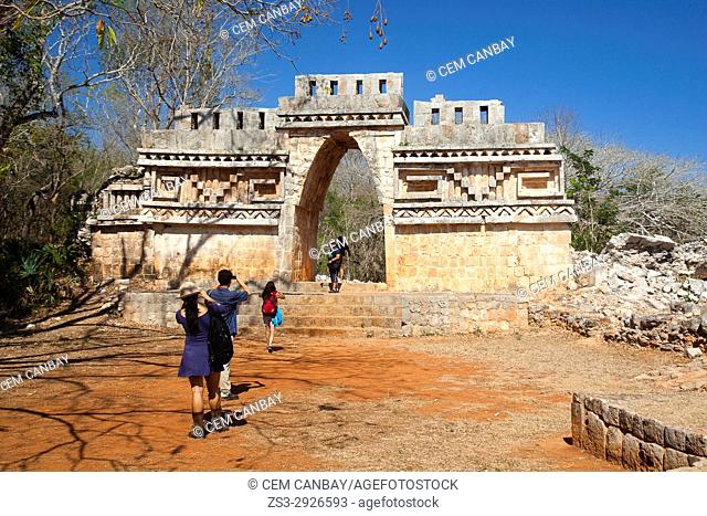 Visitors near the Labna Arch in the Labna Archaeological site, Puuc Route, Merida, Yucatan State, Mexico, Central America