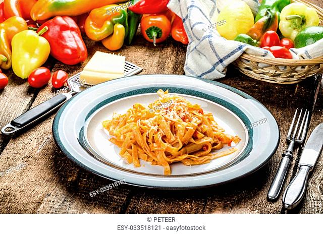 Pasta arrabiata with peppers from bio garden