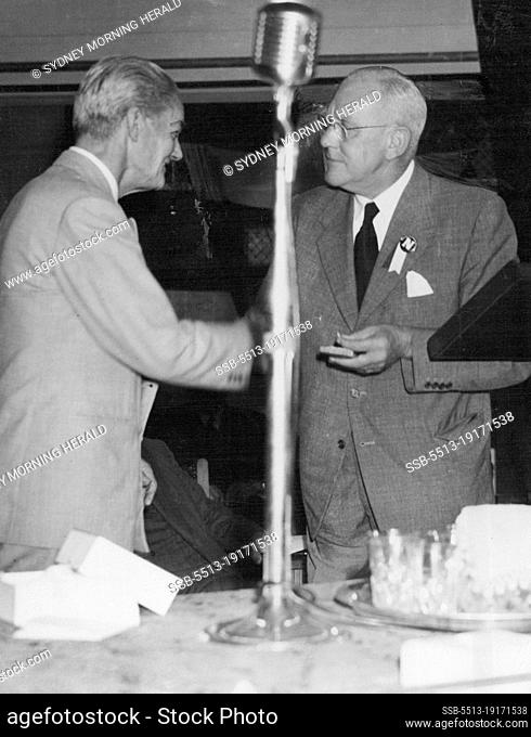 At right, Mr. G. A. Lloyd general manager of the Nuffield factory, presents Viscount Nuffield with one of 17 gold sovereigns discovered while preparing the site...