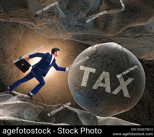 The businessman in high taxes business concept