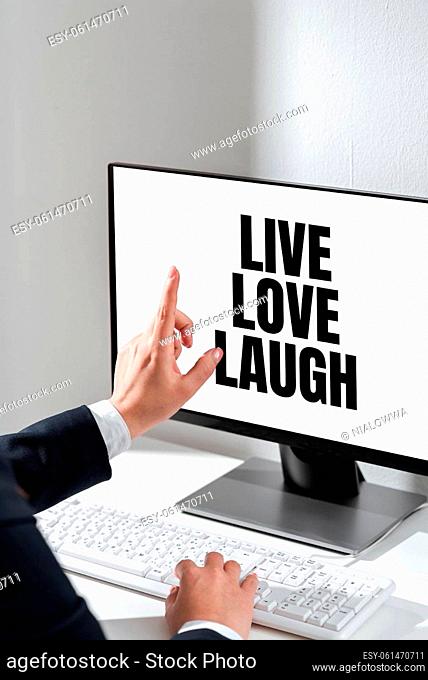 Sign displaying Live Love Laugh, Business idea Be inspired positive enjoy your days laughing good humor Woman Typing Updates On Lap Top And Pointing New Ideas...