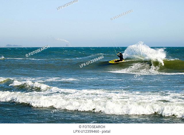 Male kite surfing