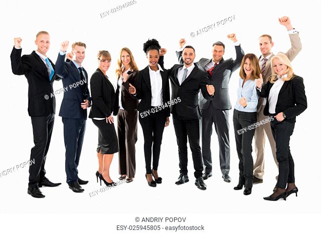 Full length portrait of happy business team celebrating success against white background