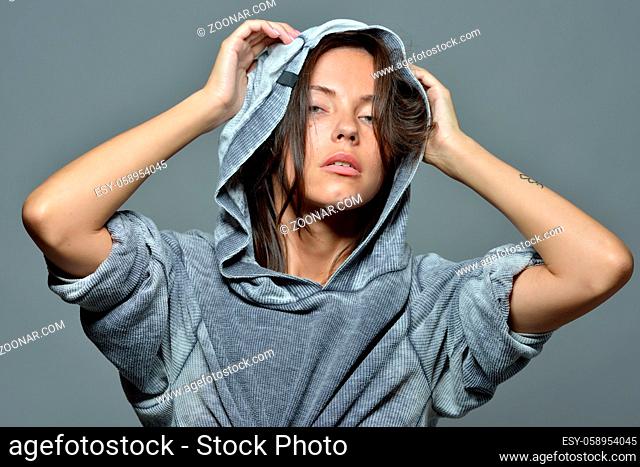 Torso Portrait of the beautiful sexy woman in grey hoody blouse