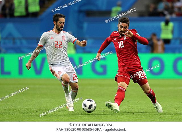 Iran's Alireza Jahanbakhsh (R) ans Spain's Isco vie for the ball during the FIFA World Cup 2018 Group B soccer match between Iran and Spain at the Kazan Arena