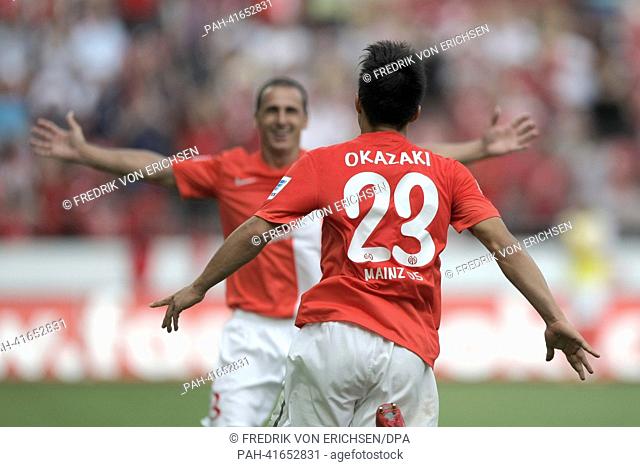 Mainz's Shinji Okazaki (FRONT) celebrates his 2-1 goal with teammate Zdenek Pospech during the Bundesliga soccer match between FSV Mainz 05 and VfB Stuttgart at...