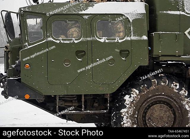 DECEMBER 3, 2023: Servicemen of a guards rocket artillery brigade of the Russian Western Military District operate a Tornado-S multiple rocket launcher on the...