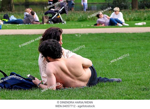 Tourists and Londoners enjoy warm spring sunshine in St James Park in Westminster as higher temperatures are forecast across the UK in coming week