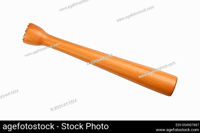Close up traditional brown wooden muddler to mash fruits for mojito isolated on white background, high angle side view