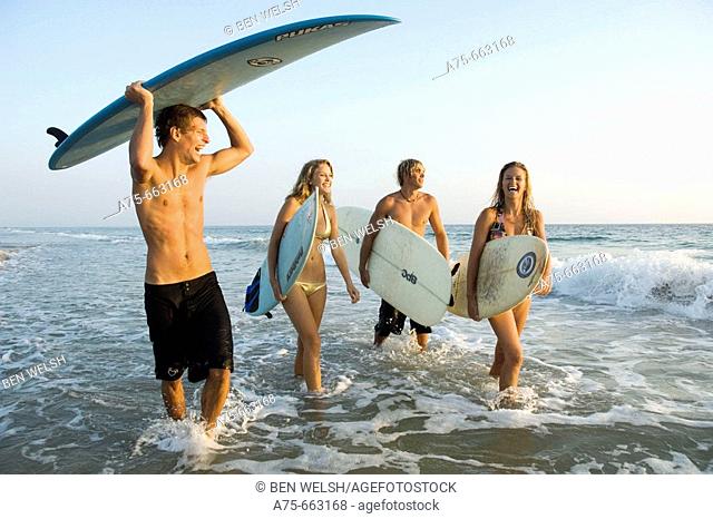 group of young surfers