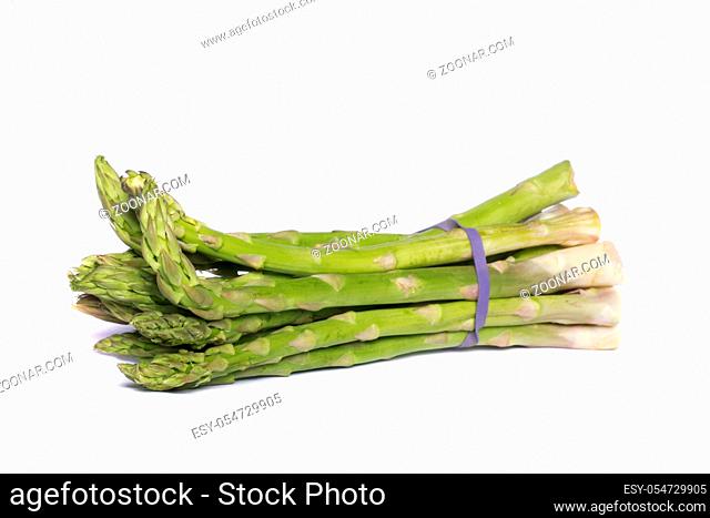 Close up view of a bunch of asparagus vegetable isolated on a white background